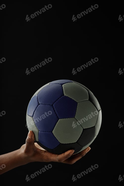 Preview: Close Up of Female Hand Holding Football Ball