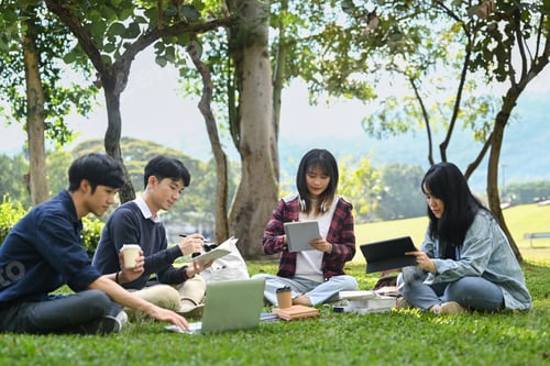 Preview: Young Asian college students working on group project and communicating.