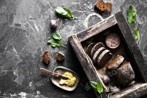 Preview: bread in an old wooden box already cut into pieces. food