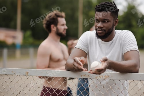 Preview: group of young multiethnic male baseball players on court