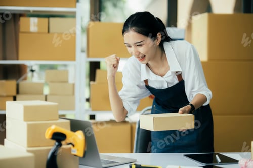 Preview: Young asian women happy after new order from customer.