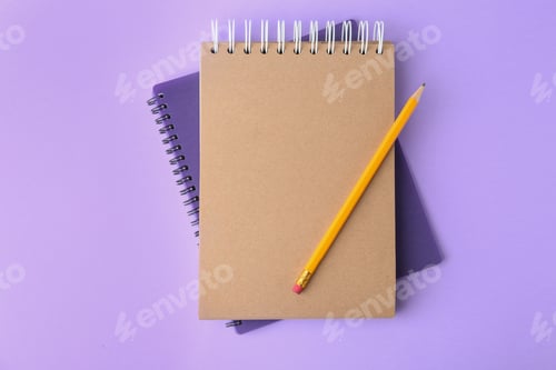 Preview: Notebooks with pencil on lilac background, top view
