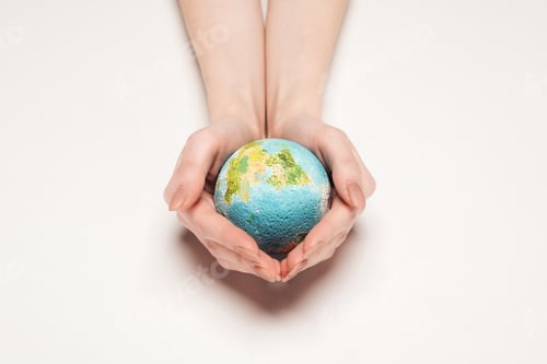 Preview: cropped view of woman holding globe model on white background, global warming concept