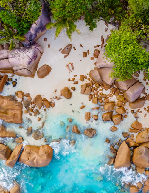 Preview: Anse Lazio Praslin Seychelles, a young couple of men and women on a tropical beach during vacation
