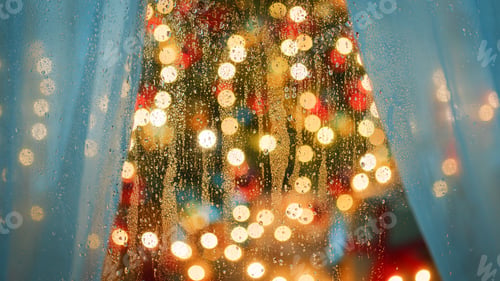 Preview: Christmas tree behind wet glass
