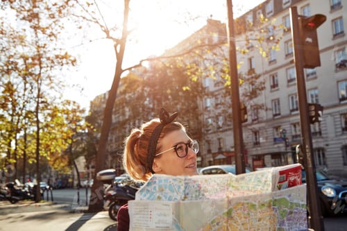 Preview: Woman Tourist Using City Map In Paris Streets, France.