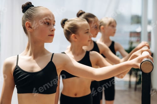 Preview: Standing together. Girls practicing ballet indoors in the class