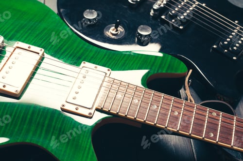 Preview: Electric guitar body and neck detail on wooden background
