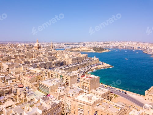 Preview: Aerial view of old town buildings near water in Valletta, Malta