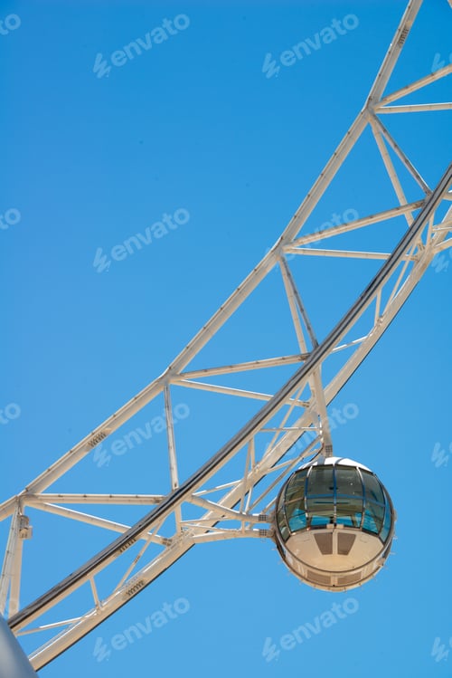 Preview: Close-up Ferris wheel carriage against blue sky