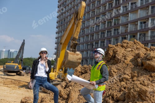 Preview: Two construction professionals at construction site.