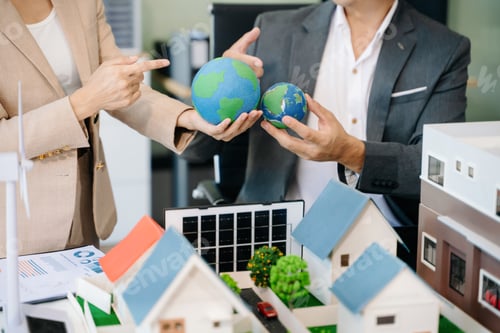 Preview: Experts collaborate on renewable energy solutions with house models, wind turbines,