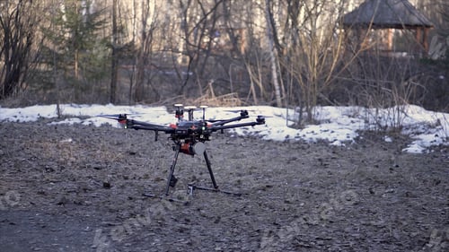 Preview: Close up for black drone standing on the ground before the flight, aerial video and photo shooting