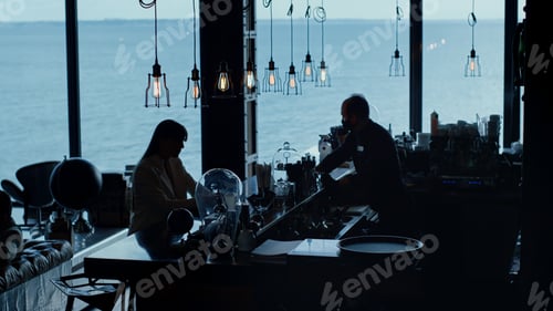 Preview: Helpless businesswoman silhouette drinking cocktail ocean view. Personal crisis