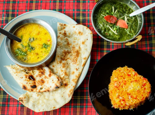 Preview: Delicious Indian Food Spread with Naan and Rice