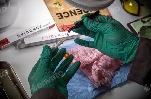Preview: Police scientist inserts rape victim's hair into vial for crime lab DNA research, conceptual image