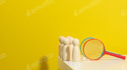 Preview: Figurines of men on a white table and magnifying glass