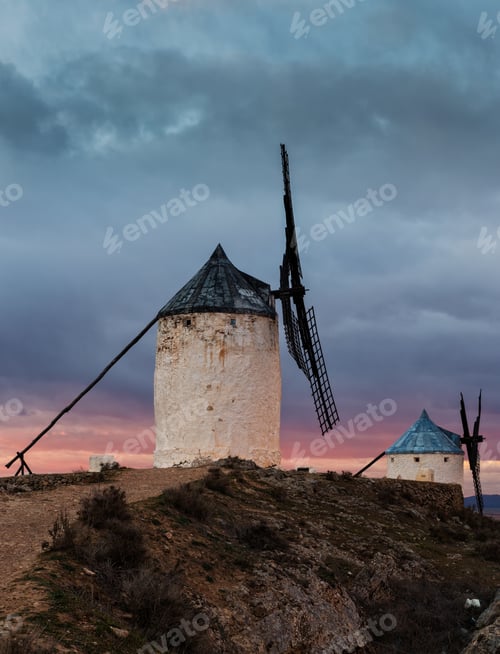 Preview: Vertical shot of traditional windmills in Consuegra, Toledo, Spain