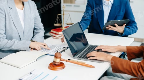 Preview: business people and lawyers discussing contract papers sitting at the table. Concepts of law,