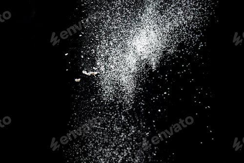 Preview: White powder explosion. White powder splash isolated on black background. Flour sifting