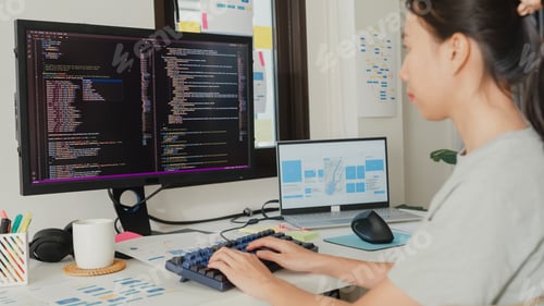 Preview: Asia girl IT development programmer typing on keyboard coding programming fixing database code.
