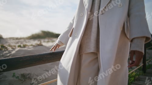Preview: Closeup girl body strolling wooden pier. Calm serene woman touching railings
