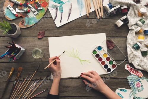 Preview: Cropped image of painter drawing at working place