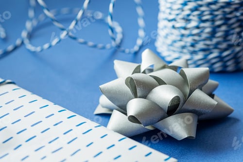 Preview: Gift packaging: silver bows for gift decoration, blue gift rope, gift in a white box