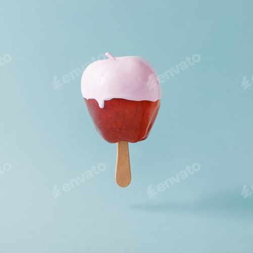 Preview: Red apple with ice cream stick on pastel blue background. Food creative concept.