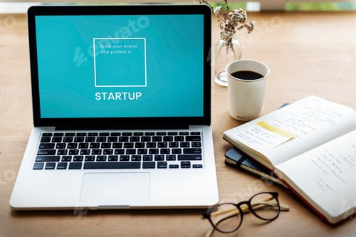 Startup Business Concept with Laptop and Coffee