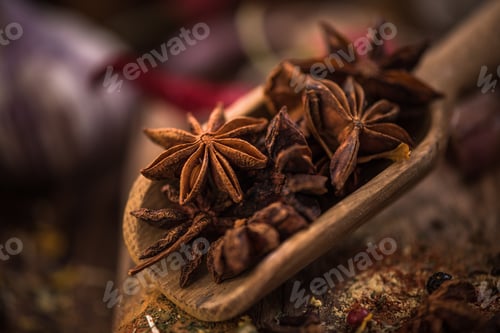 Preview: Whole anise stars on wooden spoon