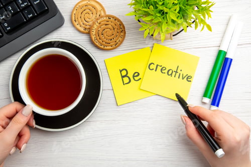 Preview: top view cup of tea with sweet biscuits and motivation notes on white background sweet business
