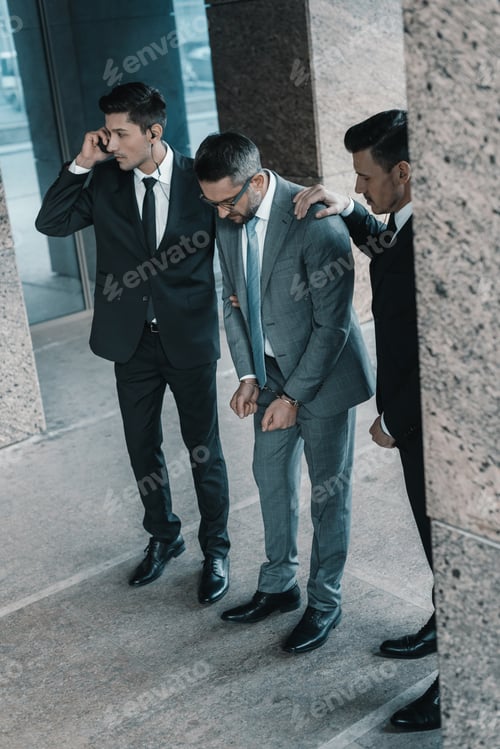 Preview: security guards standing with male suspect