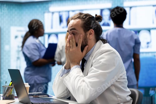 Preview: Frustrated and worried medic reading the diagnosis on test results
