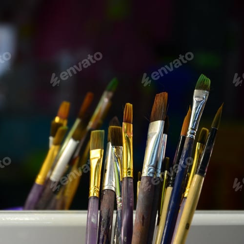 Preview: Art paint brushes in cup are located in the children's entertainment hall at the mirror
