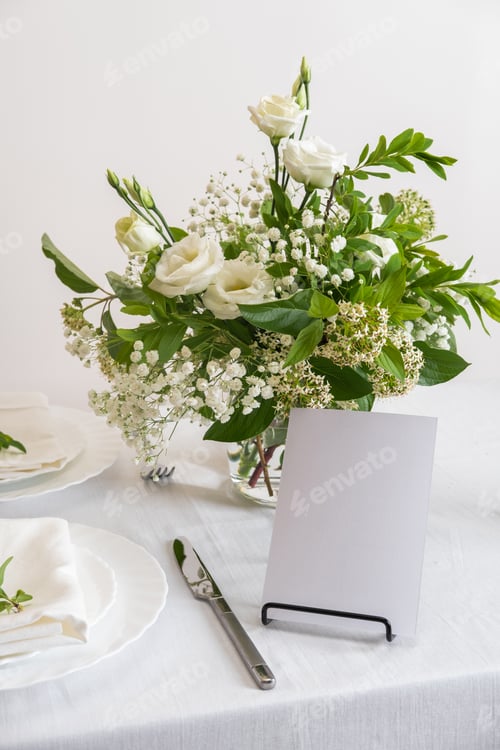 Preview: Mockup white blank space card for table number or menu. Wedding teble decoration