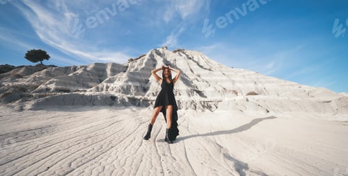 Preview: girl with long black dress in the salt desert