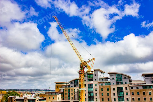 Preview: Scenic view of a big yellow crane on a cloudy sky background