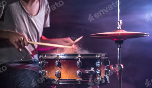Preview: The drummer plays the drums.