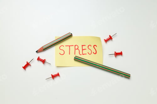 Preview: Paper with word Stress and broken pencil on white background, top view