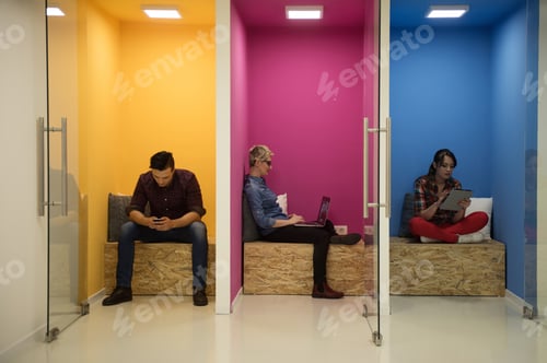 Preview: Group Of Young Business People Having Fun, Relaxing And Working In Creative Room Space At Modern
