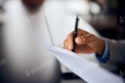 Preview: Close-up of a female hand, signing a document, using a pen.