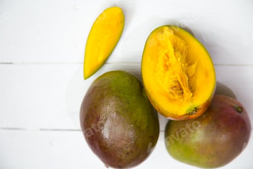 Preview: Mango fruits closeup on white wooden background,