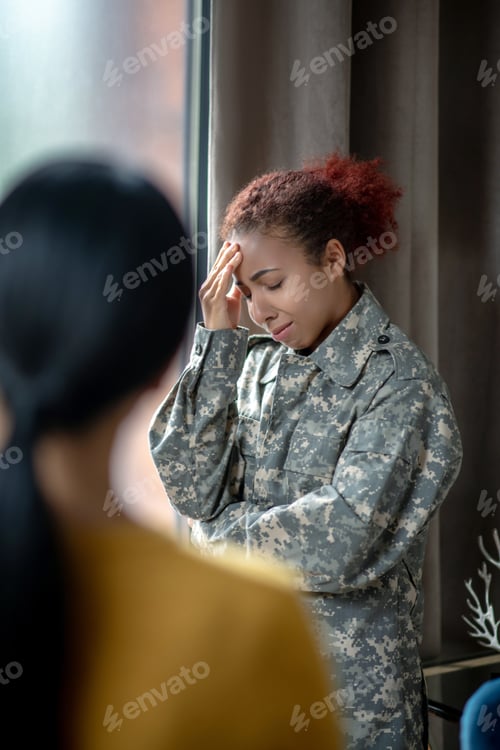 Preview: Young servicewoman crying while remembering hard moments