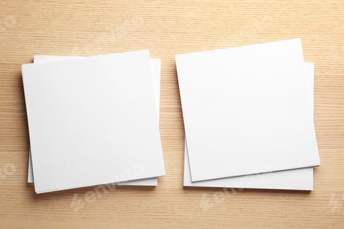 Preview: Blank paper sheets for brochure on wooden background, flat lay. Mock up