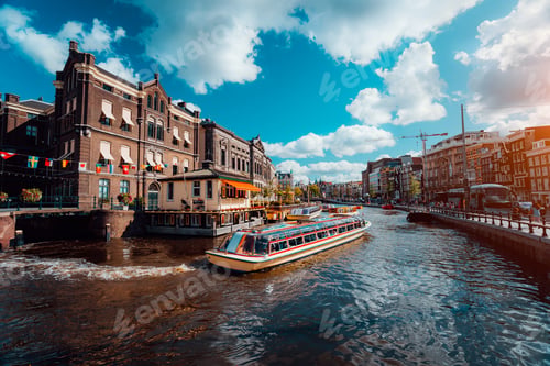 Preview: Excursion boat on the river Amstel. Cityscape of Amsterdam Netherlands. Amazing cloudscape on sunny