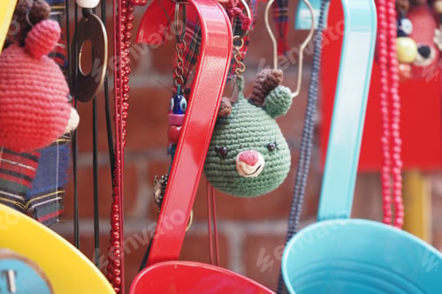 Preview: Colorful handmade keychains displayed at a craft market