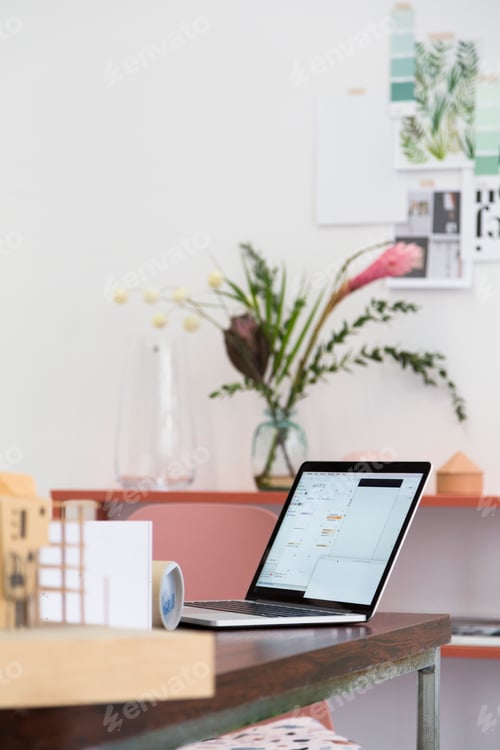 Preview: Laptop on table in an architect's loft office