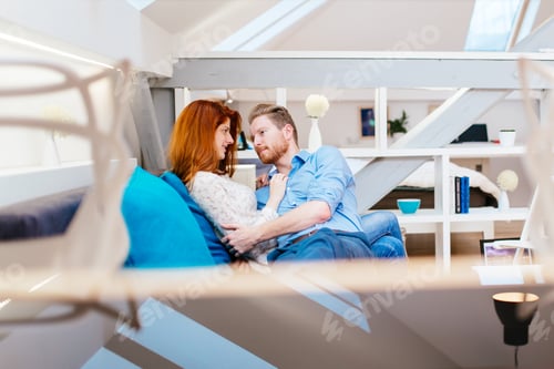 Aperçu: Couple cuddling in beautiful interior living room