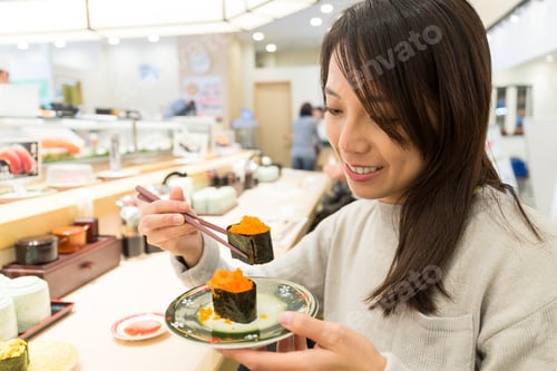 Preview: Woman eating sushi